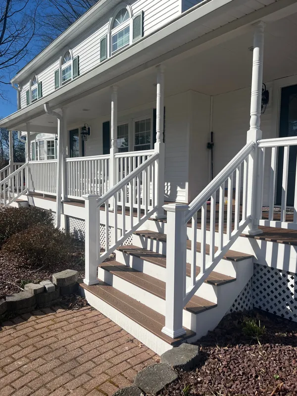 Porch steps with white railings